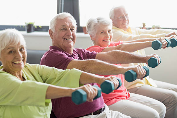 Older adults exercising with weights